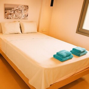 Comfortable Bedroom with Clean Lines and Natural Tones
A peaceful, thoughtfully furnished room ideal for restful sleep.