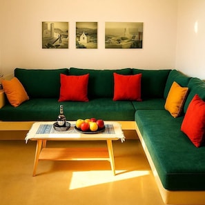 Second View of the Living Area with Natural Light
Inviting and bright with a mix of modern color and minimalist design.