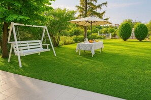 Spacious garden with outdoor furniture
