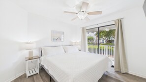 Primary bedroom with king bed and ensuite bathroom