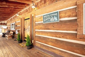 Covered and welcoming porch, great for those warm evenings and storing snow accessories. 