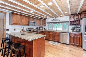 Large kitchen with everything you need to cook a holiday meal. Large refrigerator and a wine/beverage fridge for drinks. 