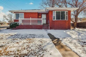 The front view of the house showcases its charming exterior, well-kept landscaping, and inviting entrance, creating a warm and welcoming first impression.