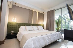 Master bedroom comes with a king size bed, A/C, SmarTV, access to balcony, walk-in closet and private bathroom. 