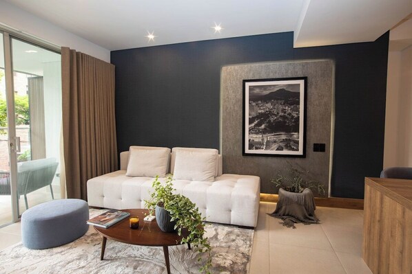 Beautiful and well ventilated living room with direct access to the big balcony. 