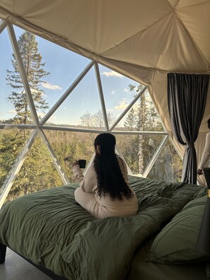 Enjoy the view and your coffee from your king-size bed