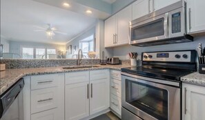 This bright, airy kitchen is perfect for entertaining guests or preparing a family meal. The open layout lets you stay connected to the living area while cooking.