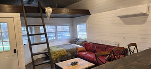 one large room and has it all.   fully size couch bed, sofa, chairs, dining area