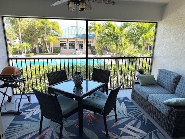 Screened-in porch with dining and sitting area