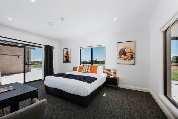 Unwind in this beautifully designed room, complete with a plush king-sized bed and an ensuite bathroom thoughtfully equipped with accessibility features. 