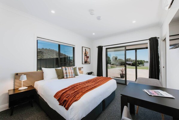 Enjoy a spacious suite to come home to after exploring Mudgee, with a king-sized bed and wall-hung TV.