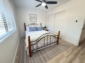 Bedroom 1 with cozy full-size bed and closet