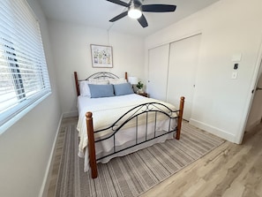 Bedroom 1 with cozy full-size bed and closet