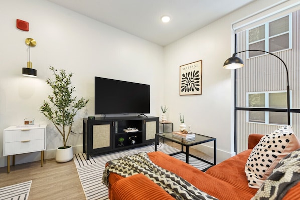 Comfortable living area with a 55" Google TV and modern decor—great for relaxing after a day of exploring. 📺