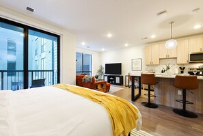 Watch TV from your King bed on the 65" LED TV!