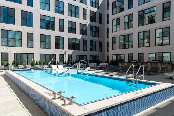 Outdoor pool and lounge deck perfect for soaking up the sun 🏊