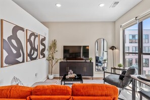 Stylish living room with 55" Smart TV and natural light 🖥️
