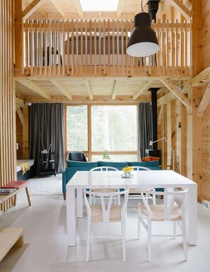 Dining area with living beyond.  Loft above.