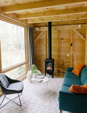 Gas fireplace keeps the cabin toasty on cozy, chilly evenings. 