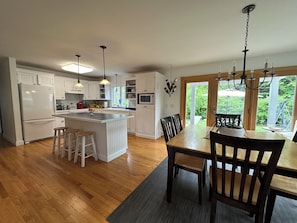 Open dining and kitchen area with patio access