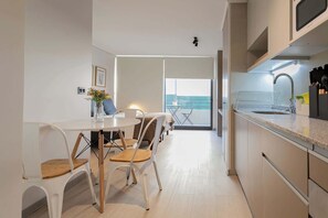 Chic studio with modern amenities and a cozy balcony, perfect for a relaxing stay in the heart of the city.