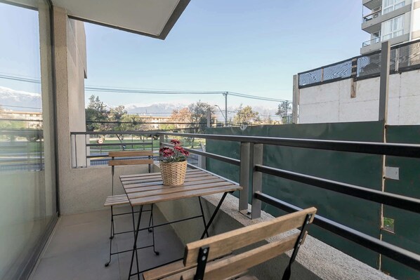 Enjoy your morning coffee with stunning mountain views from this cozy private balcony in the heart of Chile.