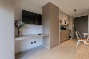 Modern studio with sleek kitchen and cozy living area, perfect for a comfortable stay in the heart of Chile.