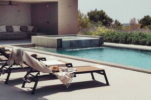 Pool area with sun loungers 
