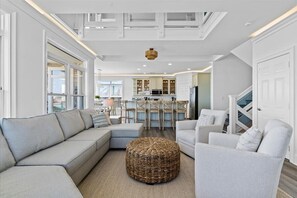 Luxury meets comfort! This open-concept living, dining, and kitchen space is designed for unforgettable moments. 