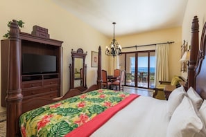 First bedroom with king bed and sitting area