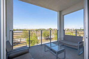 Balcony seating area with window & glass door: Chillin' spot unlocked. Natural light, comfy chairs, and the perfect vibe for your morning brew or a sunset scroll.