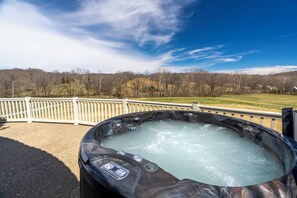 4 person hot tub on site overlooking wheat field