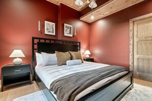 Sink into the plush, inviting bed, adorned with soft pillows and crips