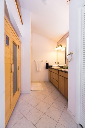 Master Suite bathroom with dual sinks and infrared dry sauna