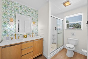 Upstairs bathroom with double vanity and standup shower