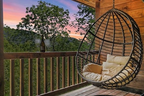 BIG CABIN - Egg chair on the big cabin deck overlooking the bluffs