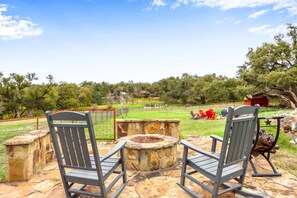 Fire pit area in the spacious back yard 