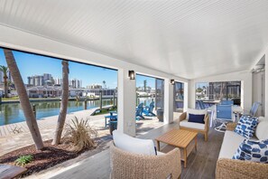 The fully electric, all weather shade screens on the lanai offer privacy and relief from the sun.
