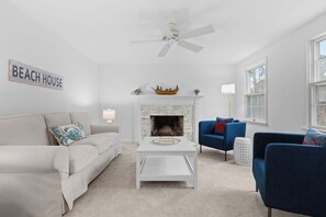 Relax in the bright living room with comfy seating for your whole crew. 