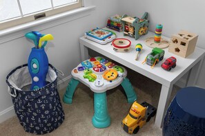 Game room fun with foosball, toys, books, board games & cozy seating. 