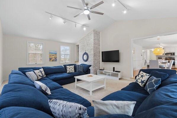 Cozy up on the oversized sectional with Smart TV and board games. 