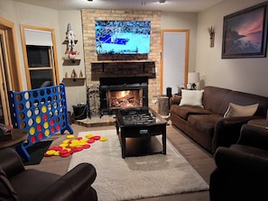 Real wood burning fireplace, foosball coffee table, giant Connect 4
