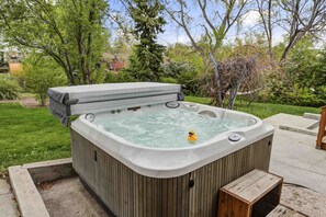 4–6 person hot tub with new string lights installed over (not yet photographed)