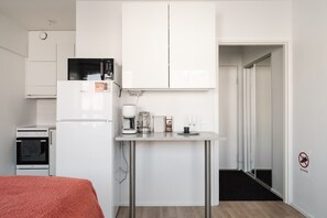 The kitchen is equipped with a microwave, coffee maker and kettle, ensuring a comfortable stay.