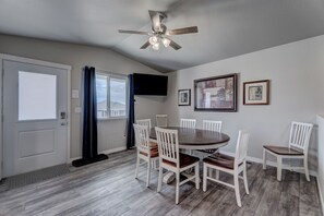 Main floor dining area with 50" Smart TV