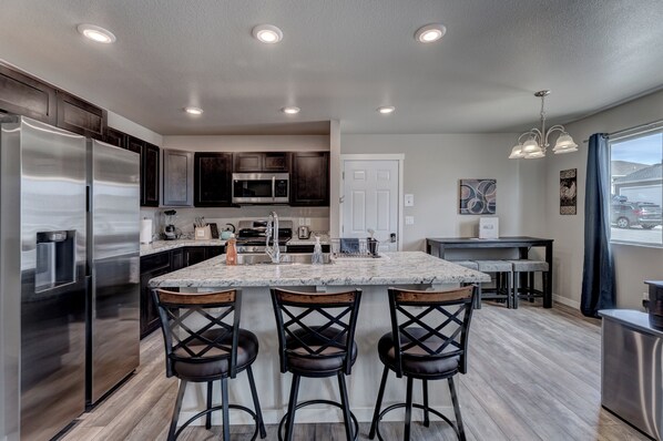 Kitchen with full complement of cookware, bakeware, and utensils
