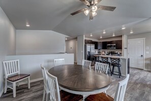 Main floor dining area with 50" Smart TV