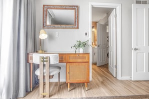 Whether you're working remotely or writing postcards home, this cozy workspace offers both style and function.