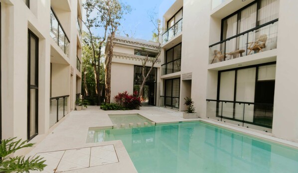 Take a refreshing dip in the shared pool just steps away from your front door.