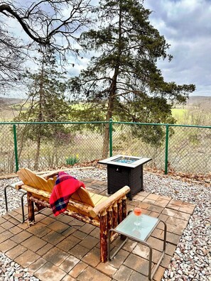 Cozy fire side with seasonal views of the creeks below
